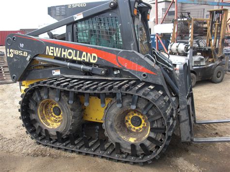 replacing tracks on new holland skid steer|biggest new holland skid steer.